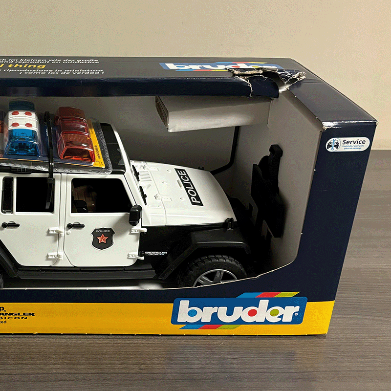 Open Box Bruder Jeep Rubicon Police Car with Policeman